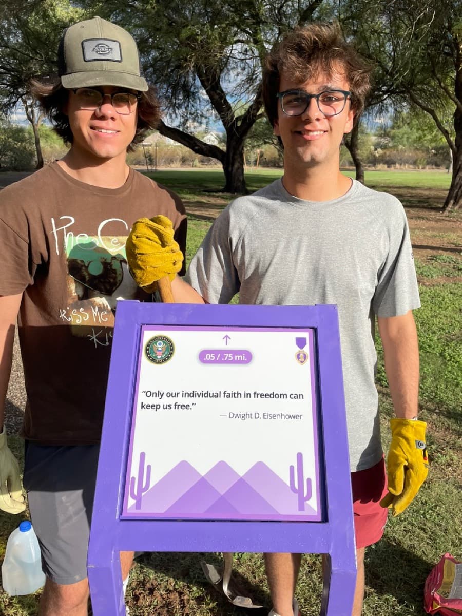 Holding one of the eleven trail markers installed at Purple Heart Park in Tucson, AZ.
